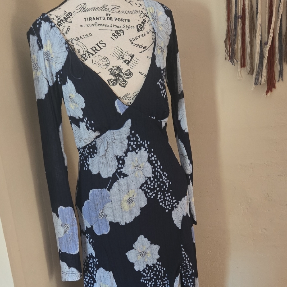 This is a Free People Calla Long Sleeve V-Neck Midi Dress